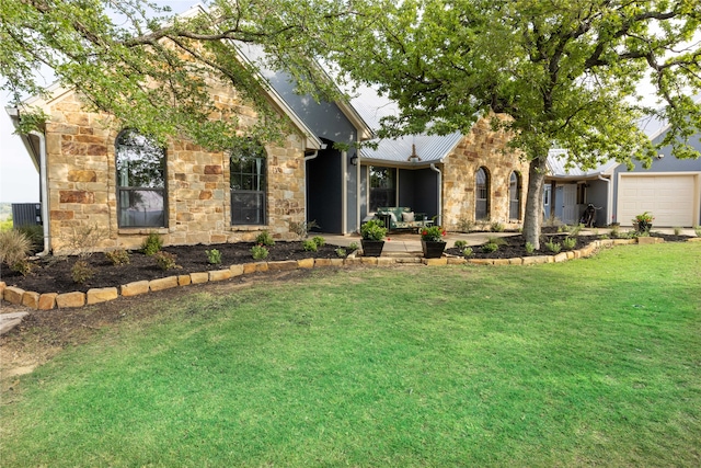 view of front of house with a front lawn and a garage