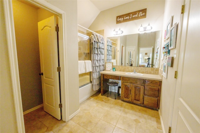 bathroom with vaulted ceiling, shower / bath combination with curtain, tile patterned flooring, and vanity