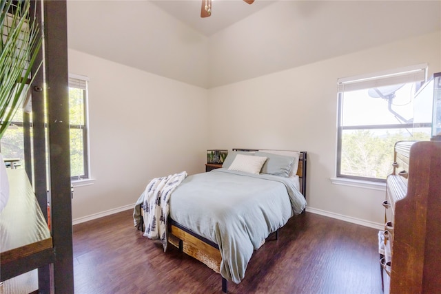 bedroom with ceiling fan and dark wood-type flooring