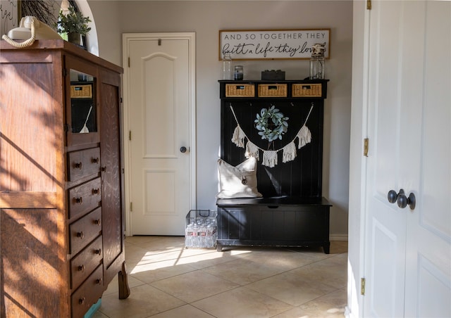 mudroom with light tile patterned floors