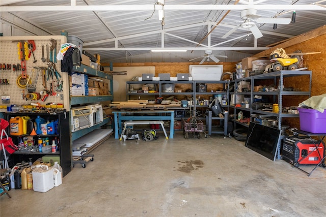 garage featuring a workshop area and ceiling fan