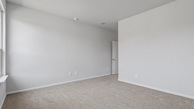 spare room featuring carpet floors