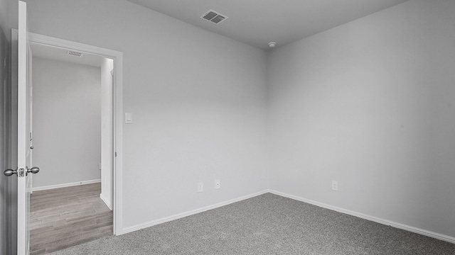 unfurnished room featuring carpet