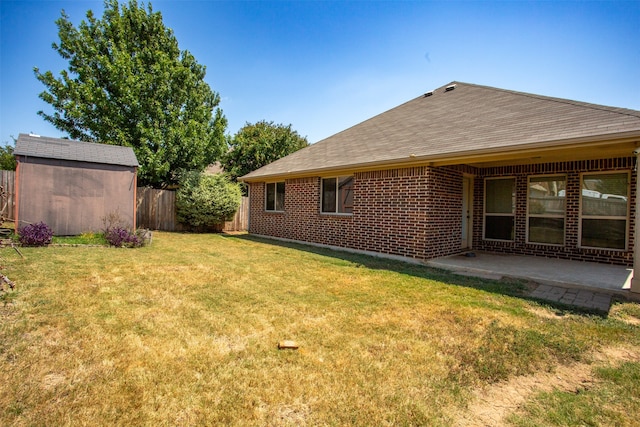 view of yard featuring a patio and a storage unit