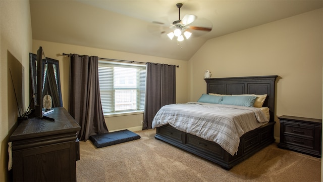 bedroom featuring light colored carpet, vaulted ceiling, and ceiling fan