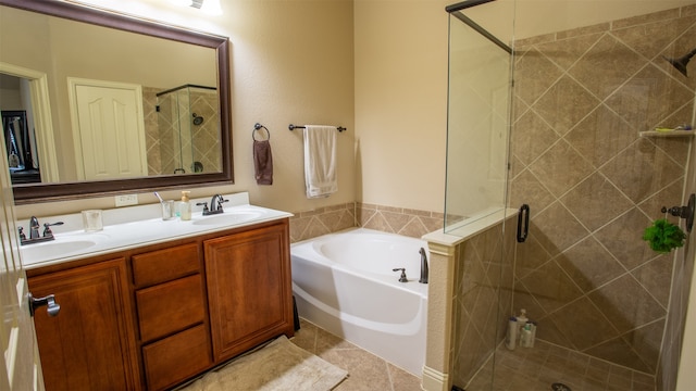 bathroom with tile patterned flooring, separate shower and tub, and vanity