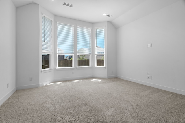 unfurnished room featuring carpet