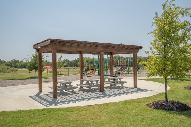 view of community with a yard and a playground