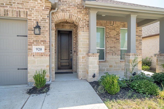 doorway to property featuring a garage