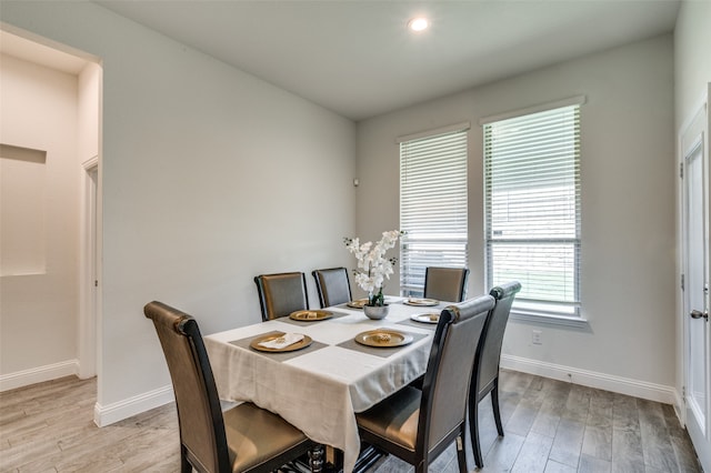 dining area with light hardwood / wood-style flooring