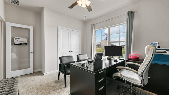 home office with ceiling fan and carpet flooring