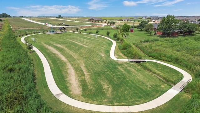 birds eye view of property with a rural view