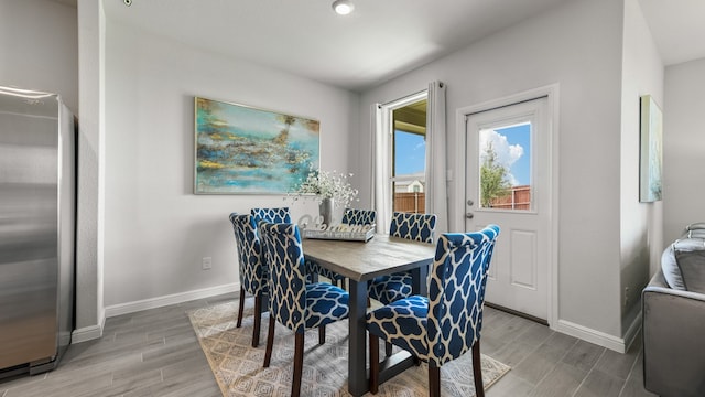 dining area with light hardwood / wood-style floors