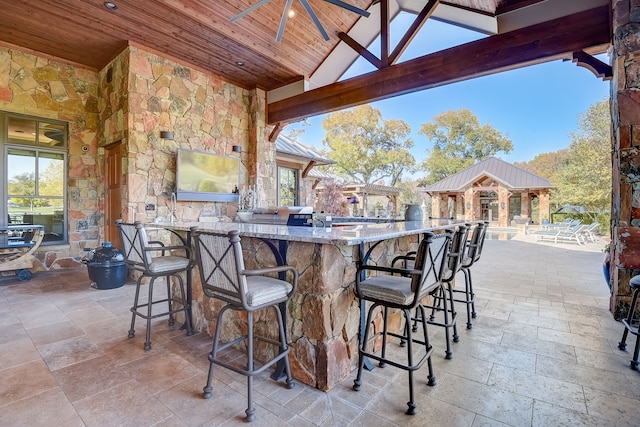 view of patio with a gazebo and a bar