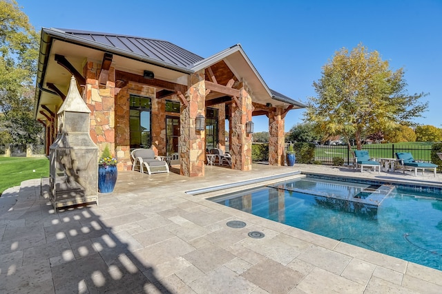 view of swimming pool with a patio