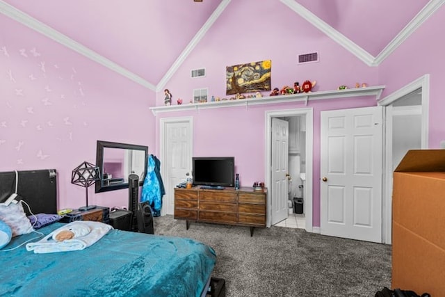 carpeted bedroom with ornamental molding and high vaulted ceiling