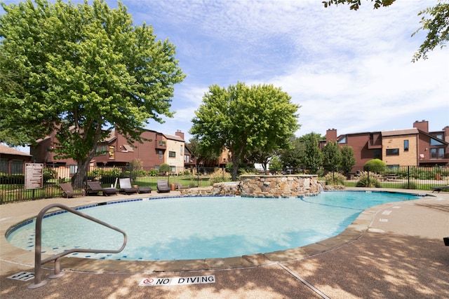 view of swimming pool featuring a patio