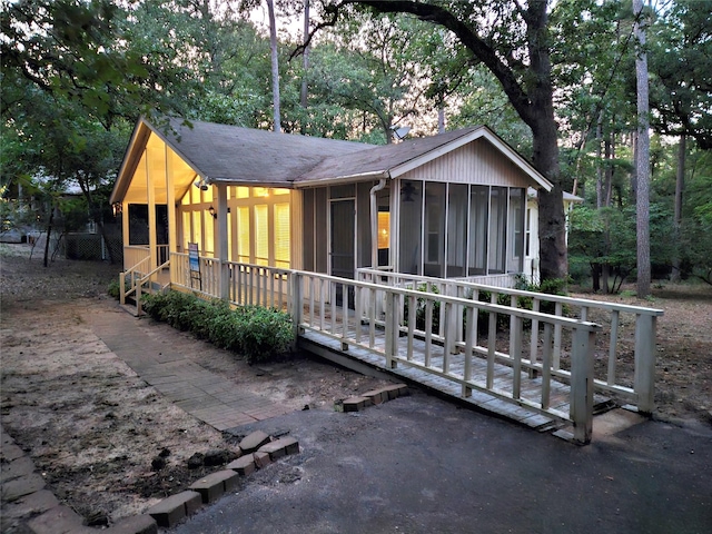 view of front of home with a sunroom