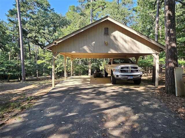 view of parking / parking lot featuring a carport