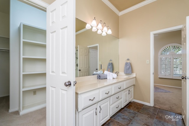 bathroom with ornamental molding, vanity, and tile patterned floors