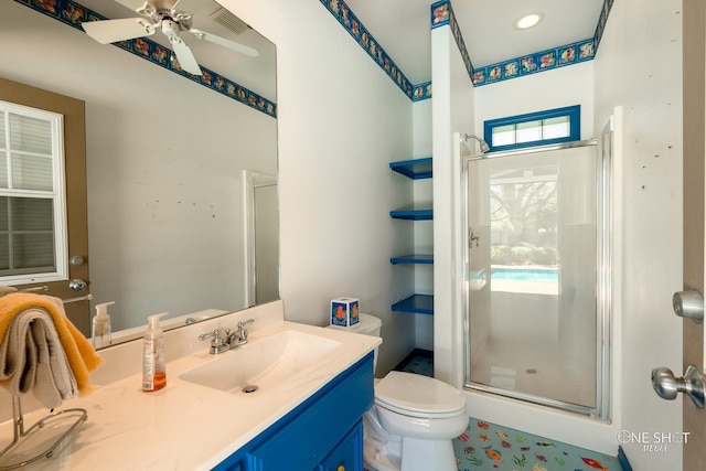 bathroom featuring ceiling fan, toilet, an enclosed shower, and vanity