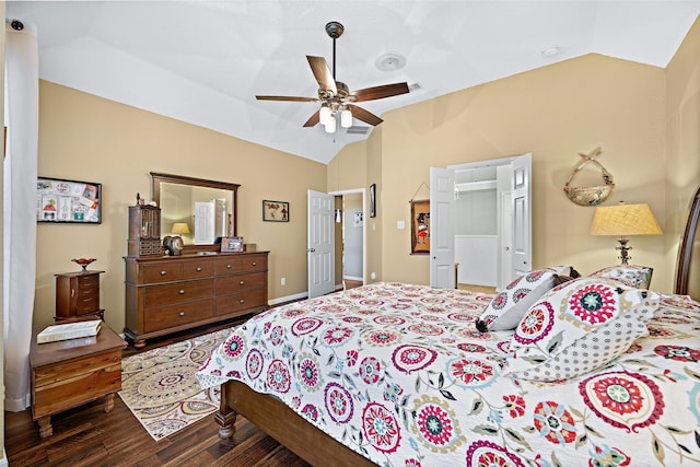 bedroom featuring dark wood-type flooring, lofted ceiling, and ceiling fan