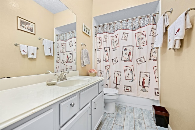 full bath with toilet, wood finish floors, shower / tub combo with curtain, and vanity