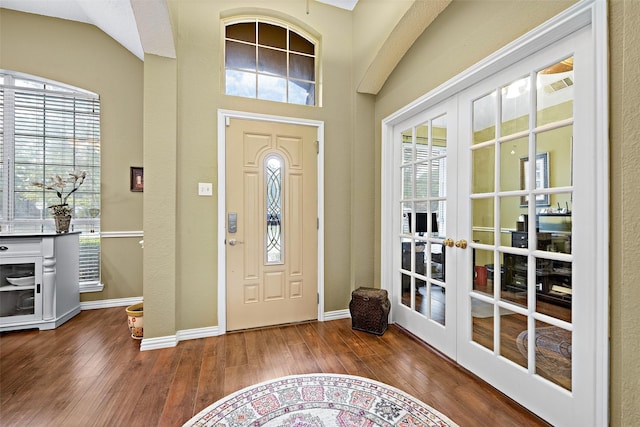 entryway with french doors, wood finished floors, and a wealth of natural light