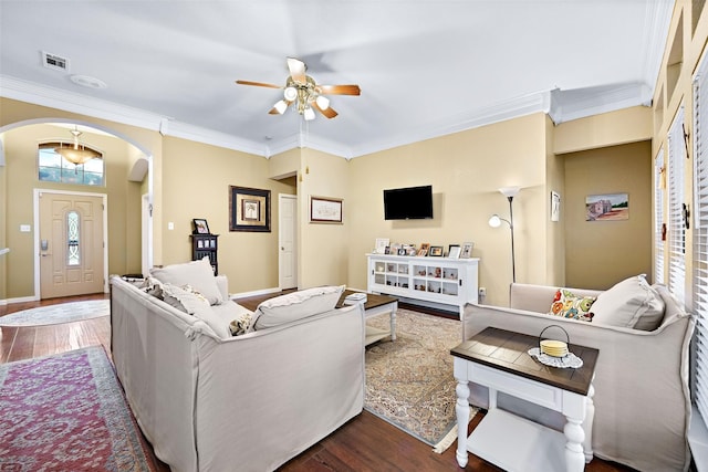 living room featuring a ceiling fan, baseboards, arched walkways, and wood finished floors