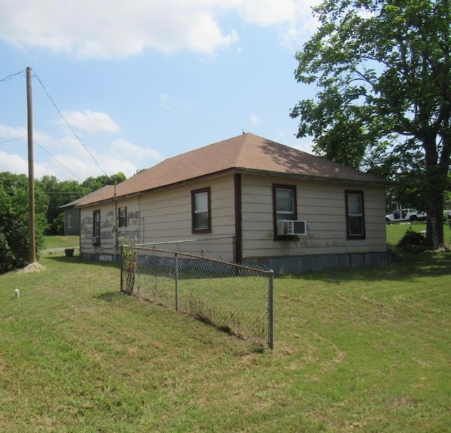 view of property exterior with a yard and cooling unit