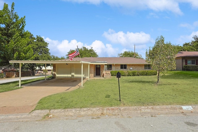 ranch-style home featuring a carport, concrete driveway, a front yard, and brick siding