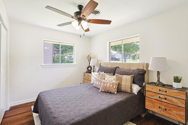 bedroom featuring ceiling fan and dark hardwood / wood-style floors