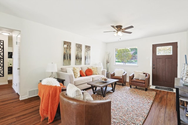 living room with ceiling fan and hardwood / wood-style flooring