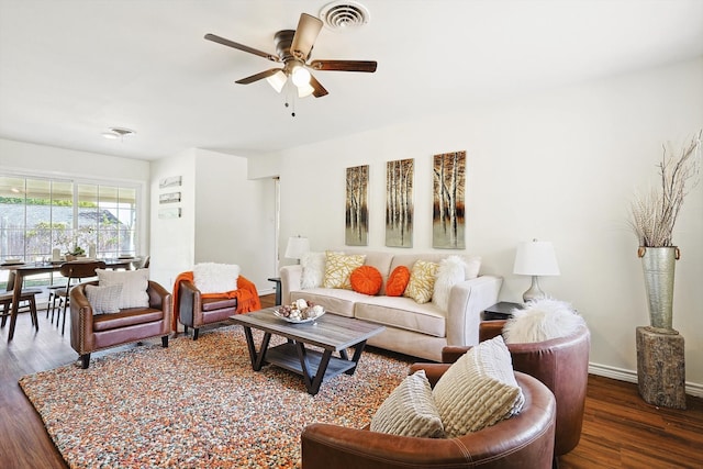 living room featuring ceiling fan and hardwood / wood-style floors