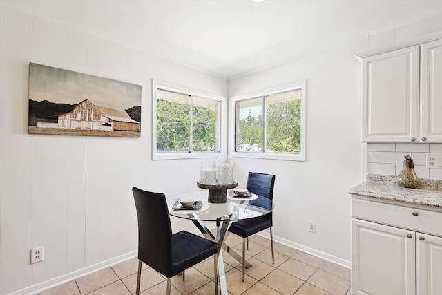 dining area featuring light tile patterned flooring