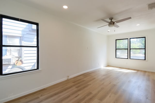 empty room featuring light hardwood / wood-style floors and ceiling fan