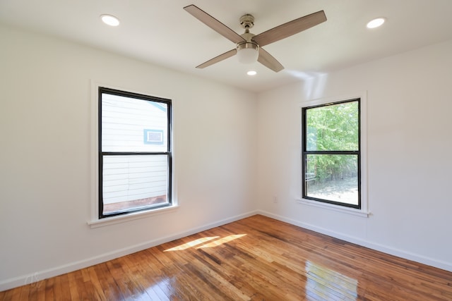 empty room featuring ceiling fan and hardwood / wood-style flooring