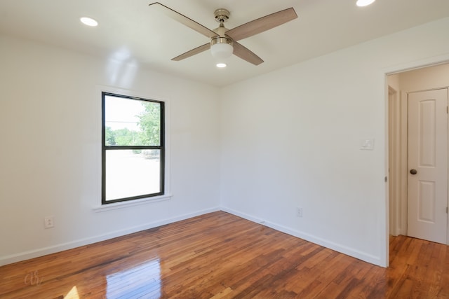 unfurnished room featuring hardwood / wood-style flooring and ceiling fan