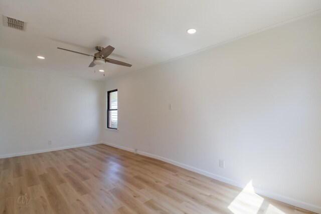 empty room featuring ceiling fan and light wood-type flooring