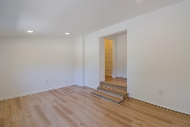 spare room featuring light hardwood / wood-style flooring