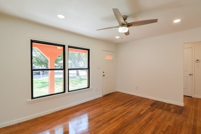 unfurnished room featuring hardwood / wood-style flooring and ceiling fan