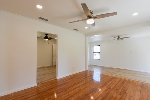 spare room featuring ceiling fan and wood-type flooring