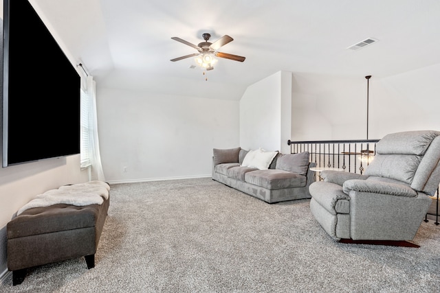 carpeted living room featuring ceiling fan and lofted ceiling