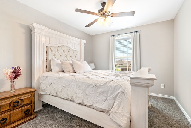 bedroom featuring dark colored carpet, a ceiling fan, and baseboards