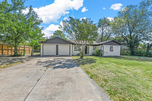 single story home featuring a front lawn and a garage