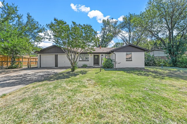 single story home featuring a front lawn and a garage