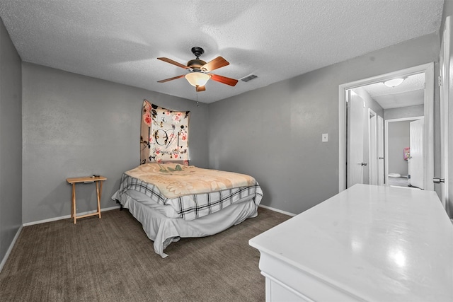 carpeted bedroom with ceiling fan and a textured ceiling