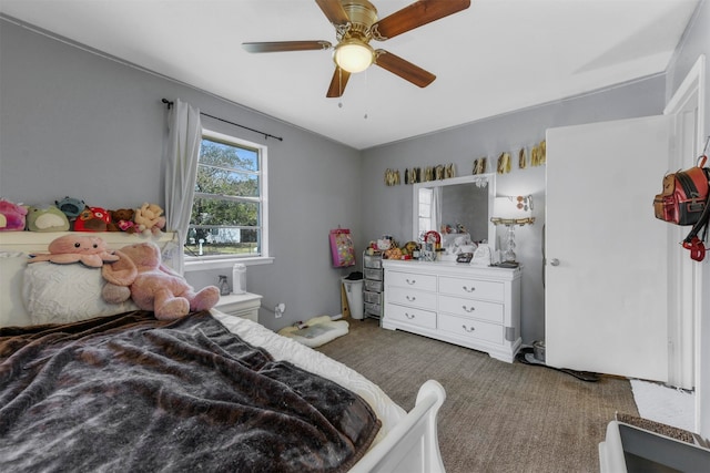 bedroom featuring ceiling fan and carpet