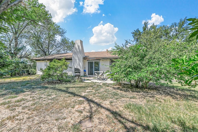 rear view of property with a patio