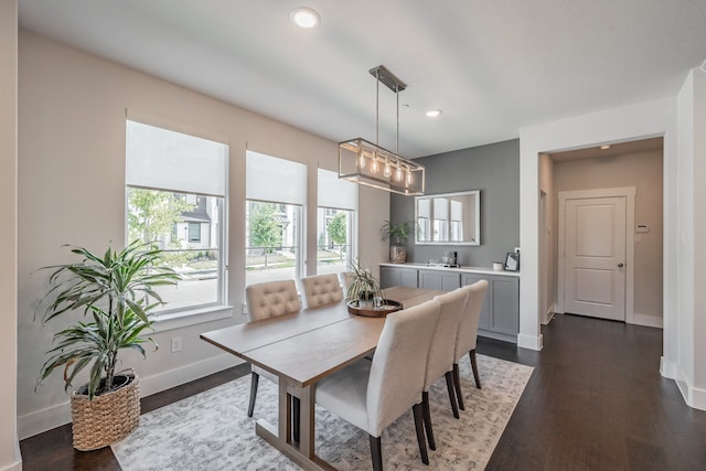 dining area featuring dark hardwood / wood-style floors